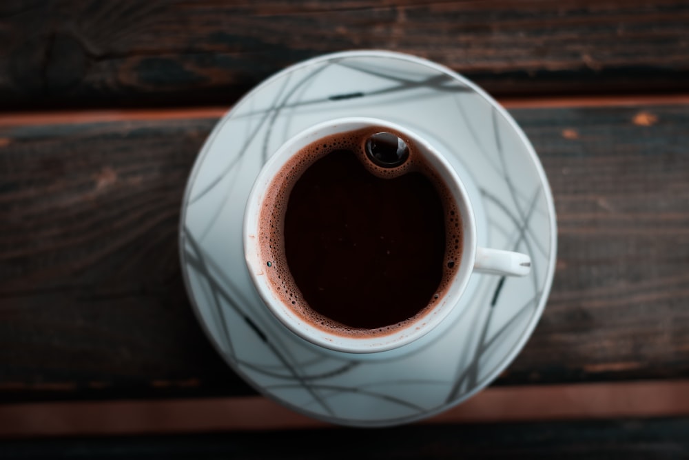 white ceramic teacup on saucer