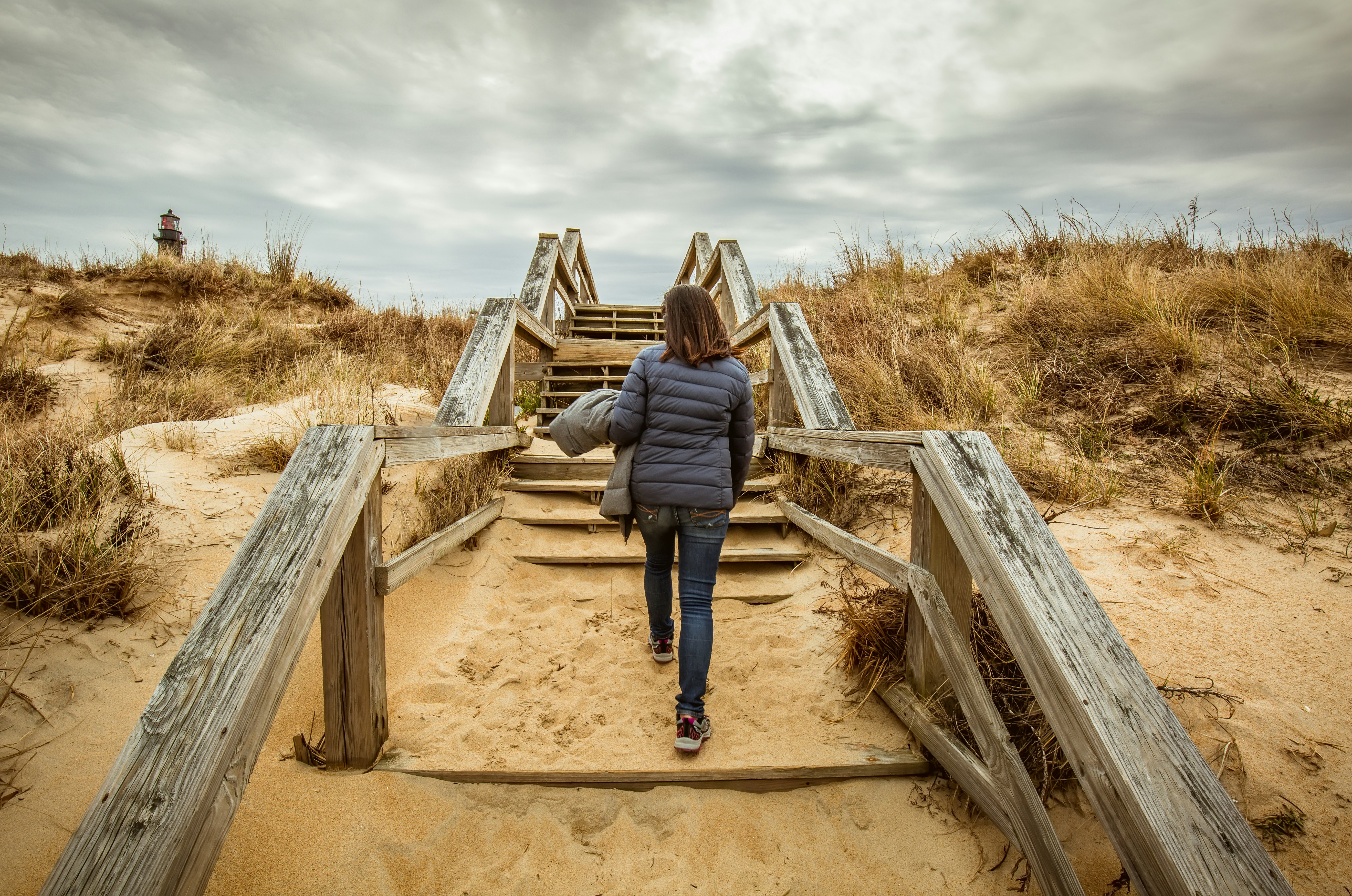 woman walking on stairs during daytime