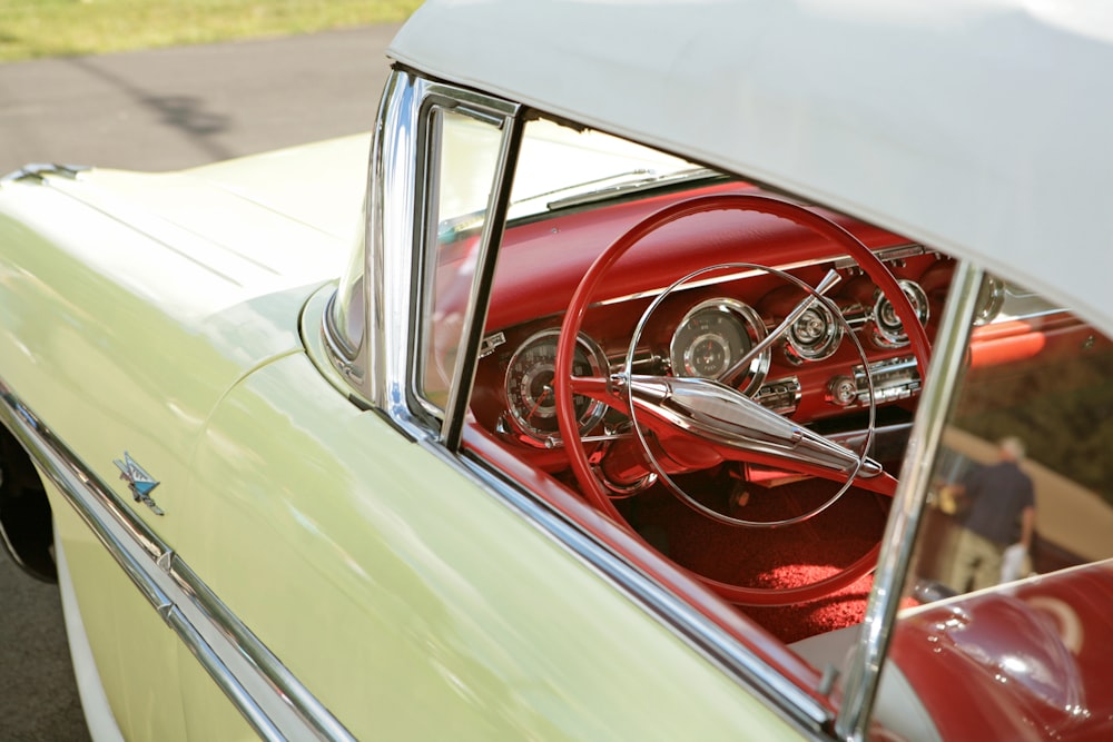 classic beige car with red interior