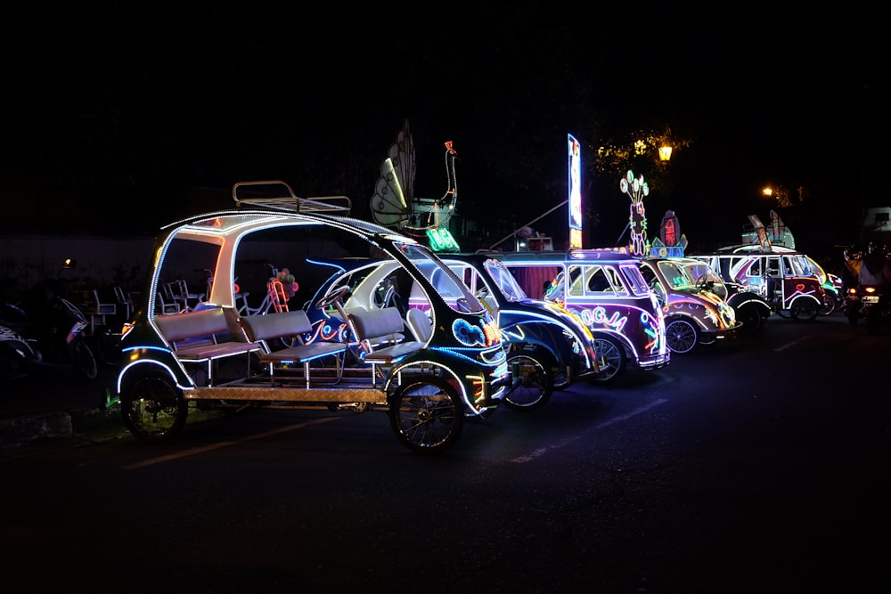 parked vehicles with neon near road