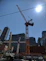 High-resolution image of a modern construction site with cranes and workers.