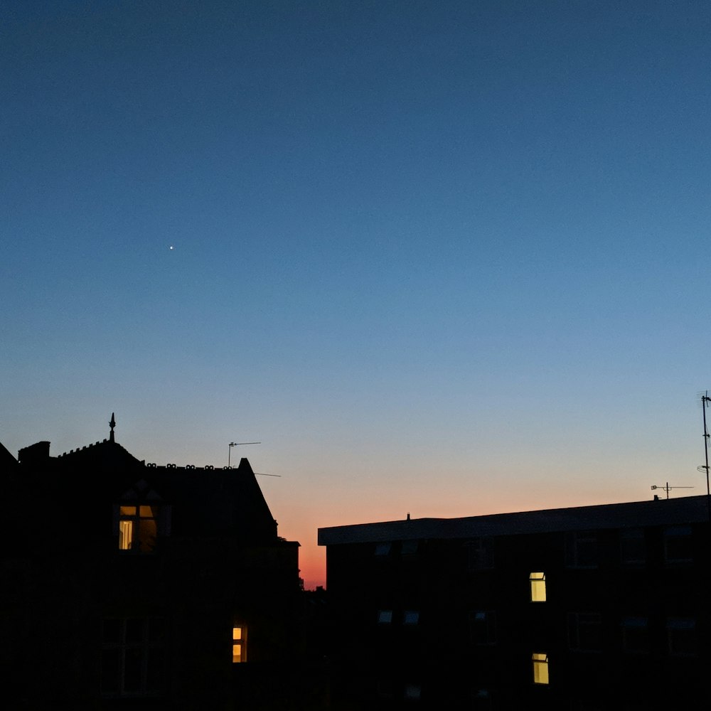 silhouette photography of house over sky