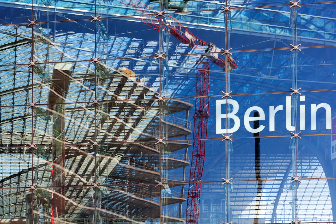 Glass building construction site illustrating lifting, access, and installation interfaces