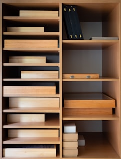 Wooden filing cabinets and shelves filled with office documents and supplies.