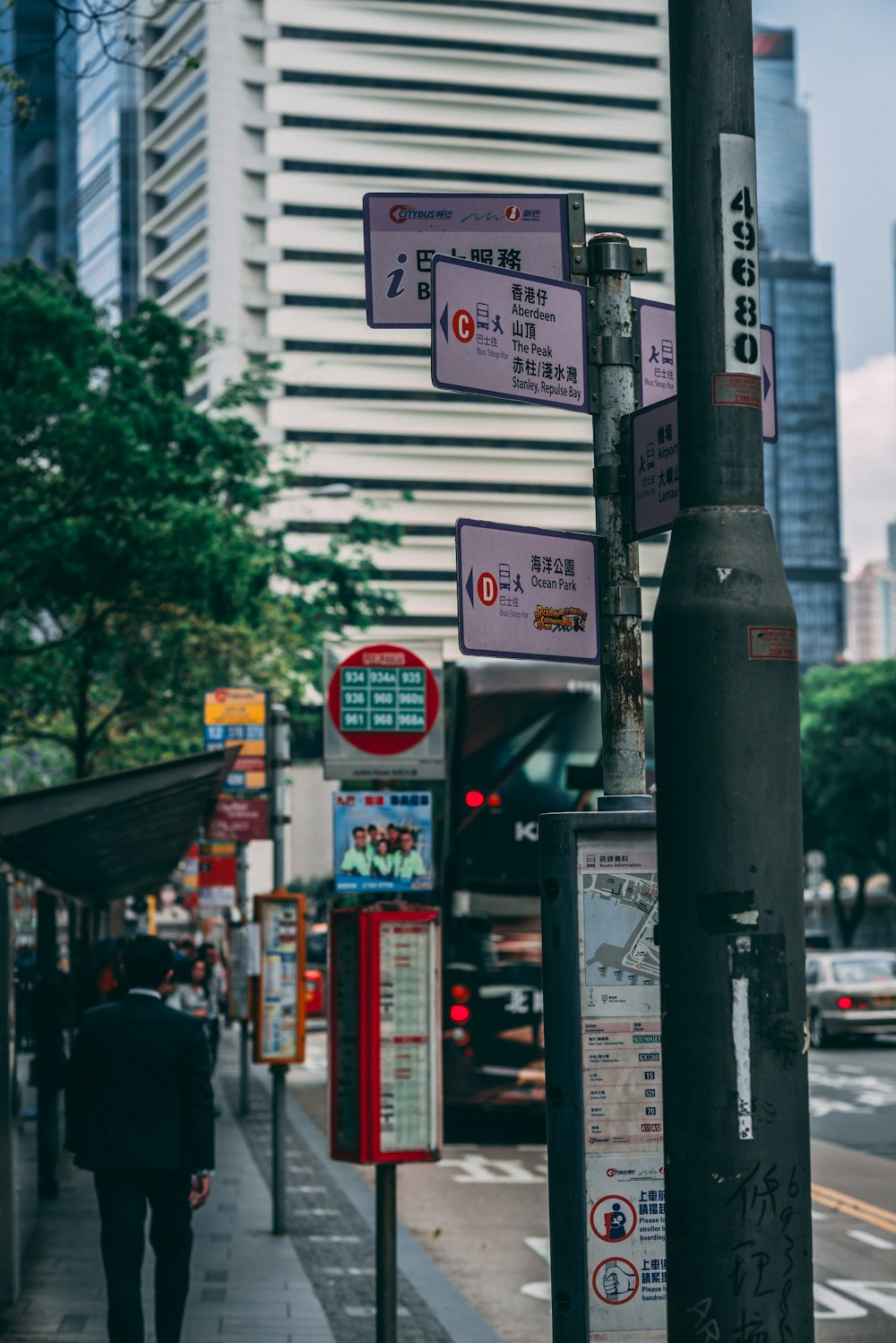 man walking near road signage