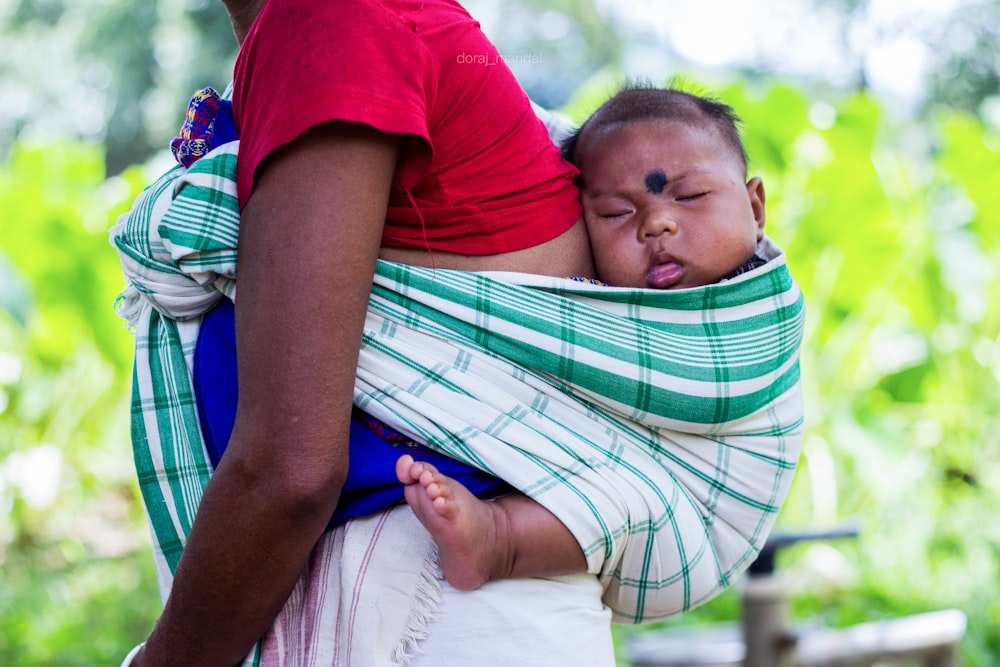 person carrying a baby