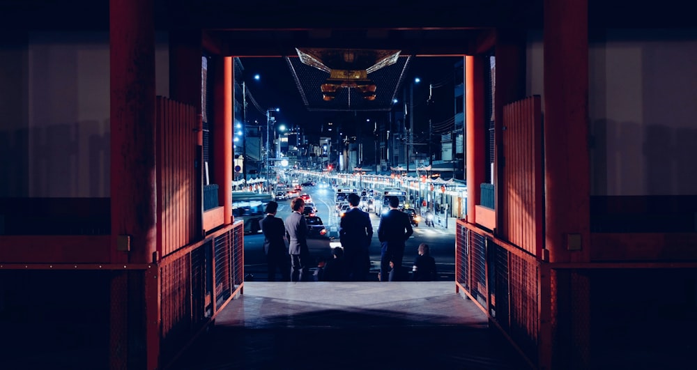 group of people inside a room digital wallpaper