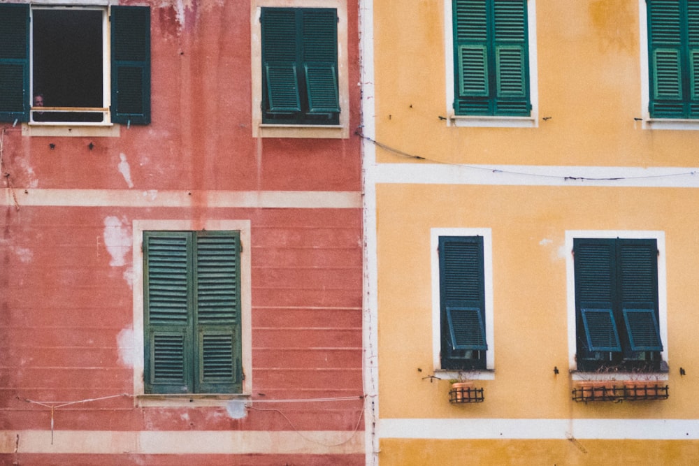 two orange and red high-rise buildings