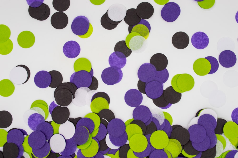 round purple, black, green, and white paper cuts
