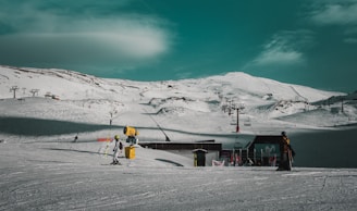 black concrete house near body of water