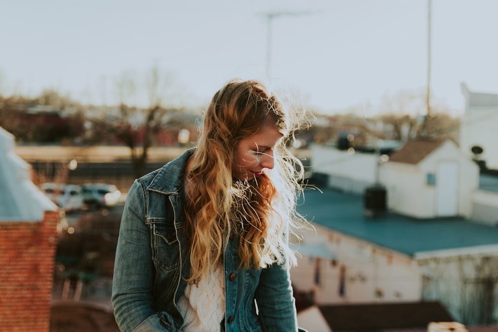 woman wear blue denim jacket