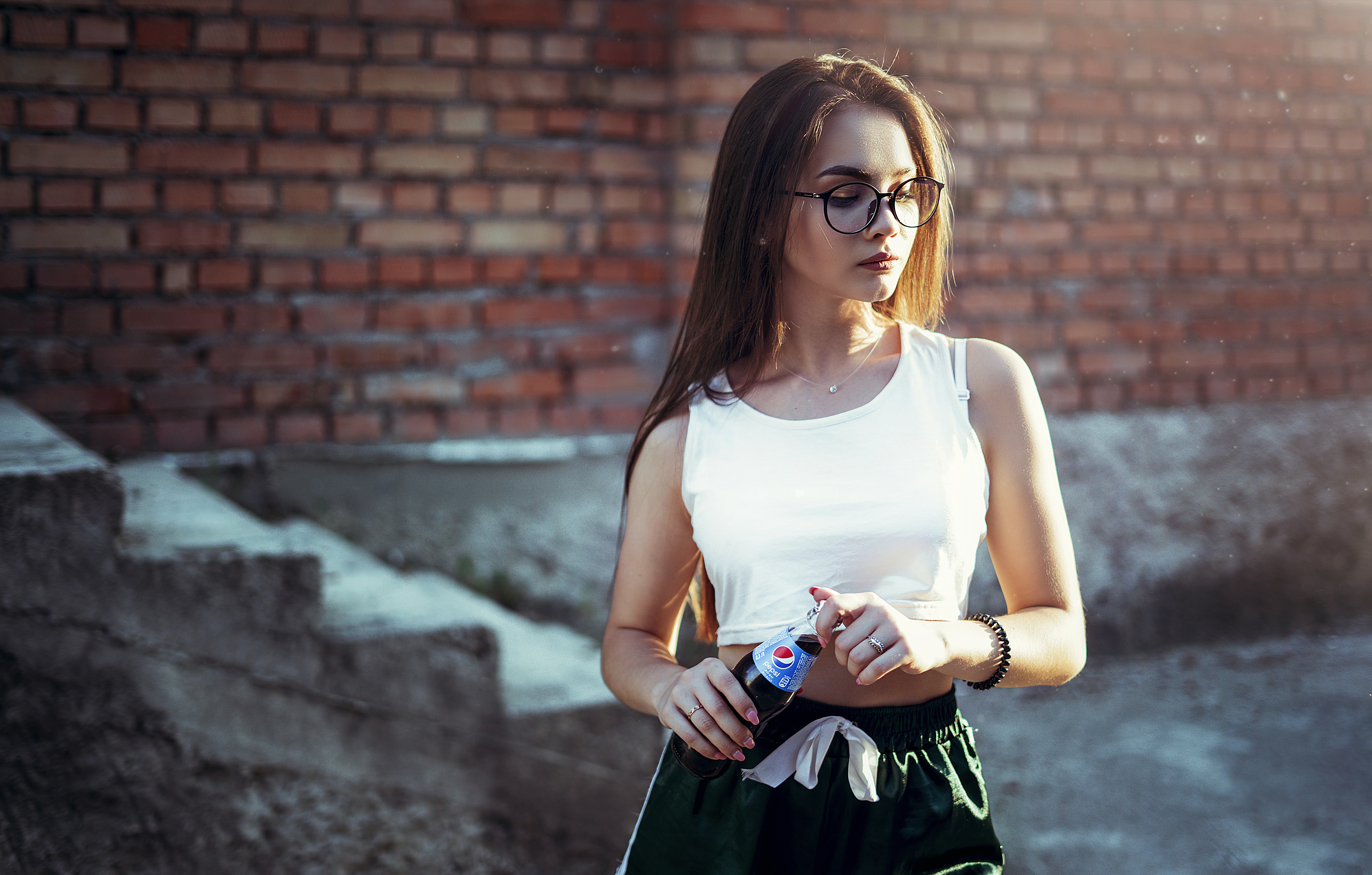 woman holding Pepsi bottle
