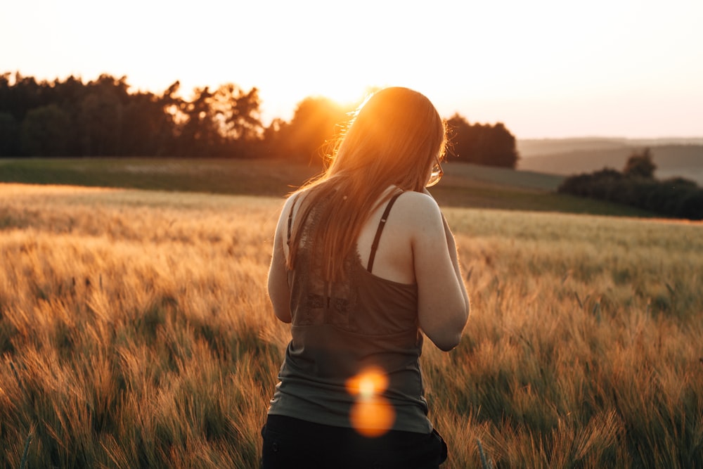 woman standing on grassfield