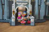 A 3D printed miniature figurine of Mickey and Minnie Mouse styled as toocute mascots.