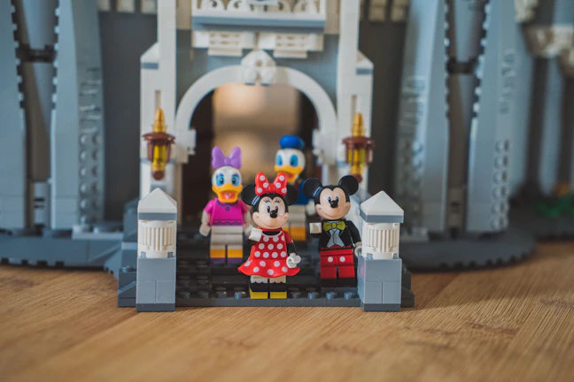 A 3D printed miniature figurine of Mickey and Minnie Mouse styled as toocute mascots.