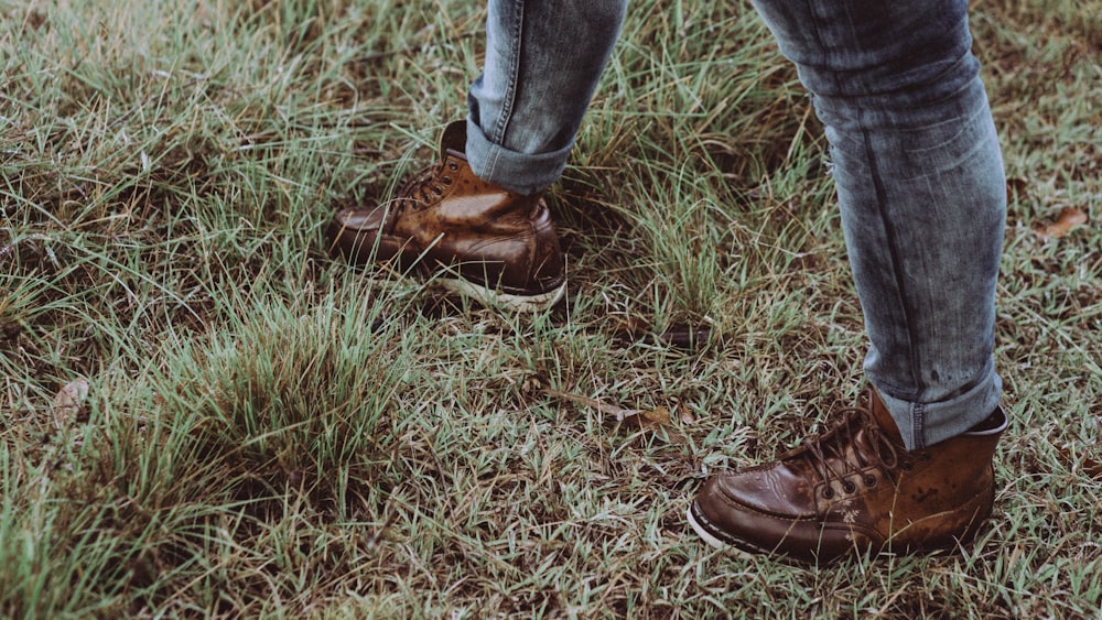 person wearing pair of brown lace-up sneakers