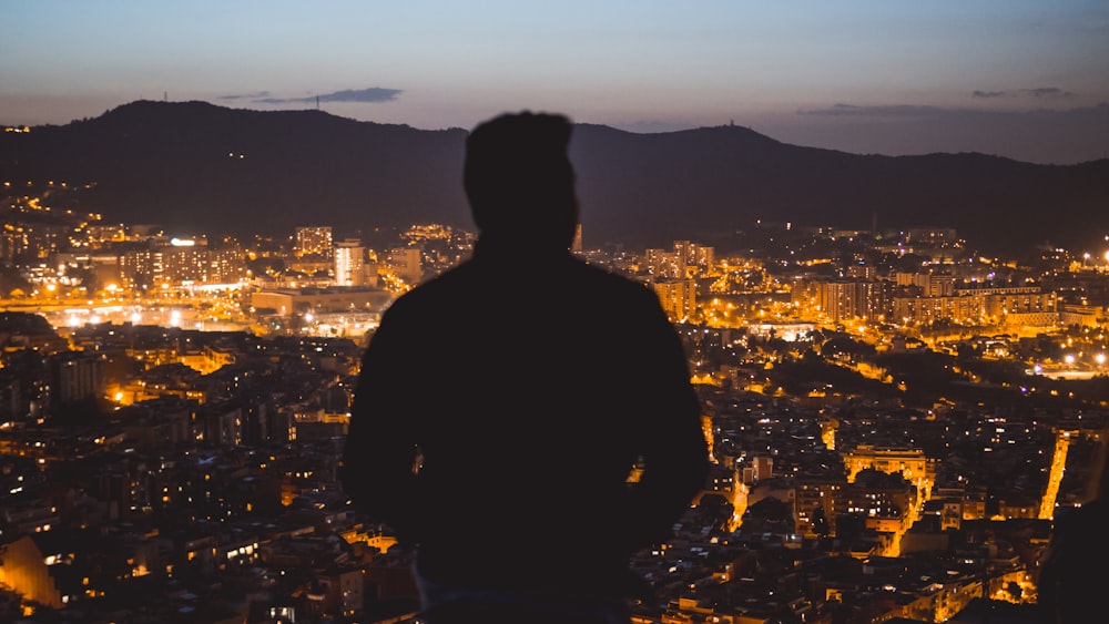 man looking at the city