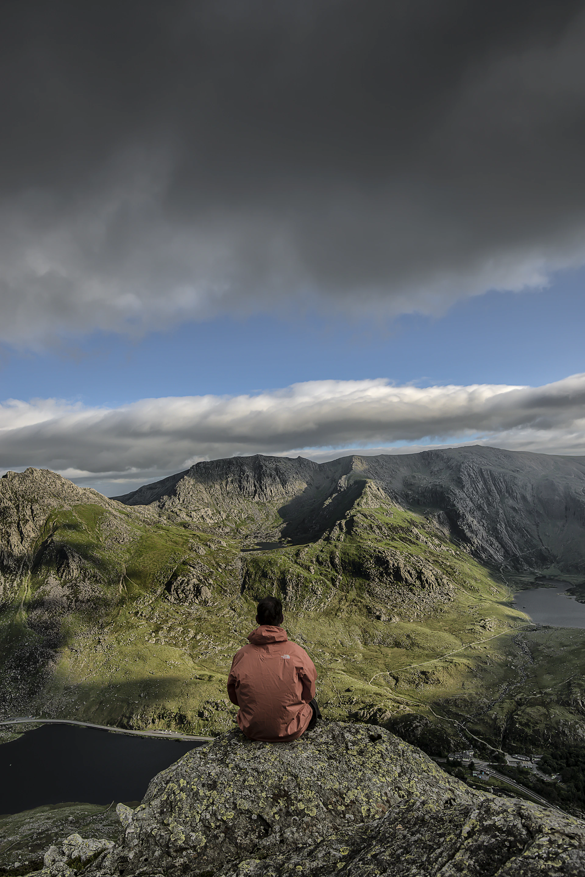 man sitting on rock