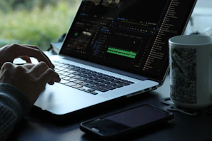 person using black and gray laptop computer