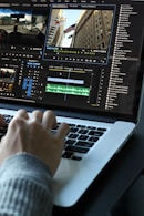 person using MacBook pro turned on