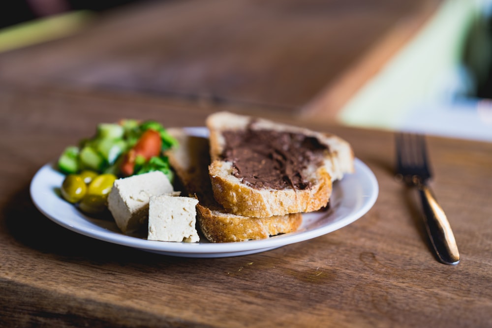 baked bread on white ceramic saucer