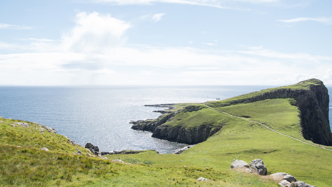 green island under blue and white sky, Isle of skye coast