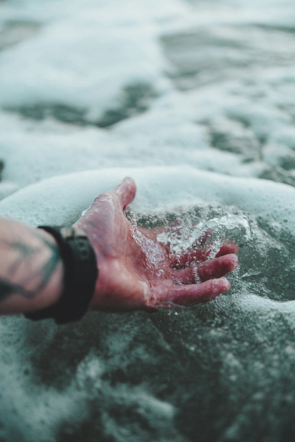 time lapse photography of person holding water