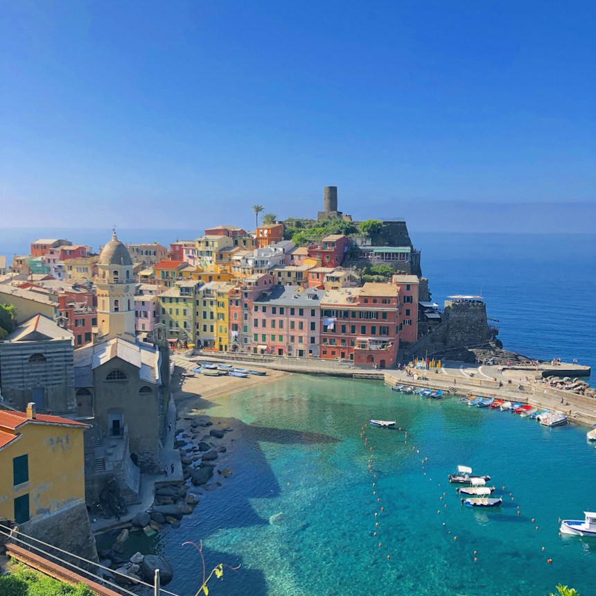 Aerial view of Vernazza's harbour on the Cinque Terre coast, a top place to visit in Italy in summer