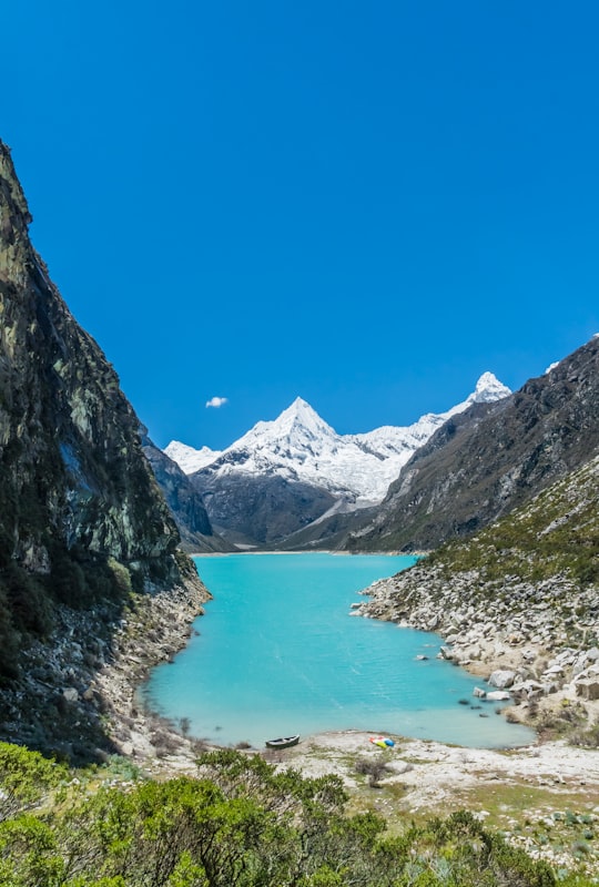 body of water surrounded by mountains in Huascarán National Park Peru