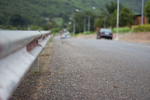 Close-up of a sleek PRFV guardrail installed along a scenic bridge