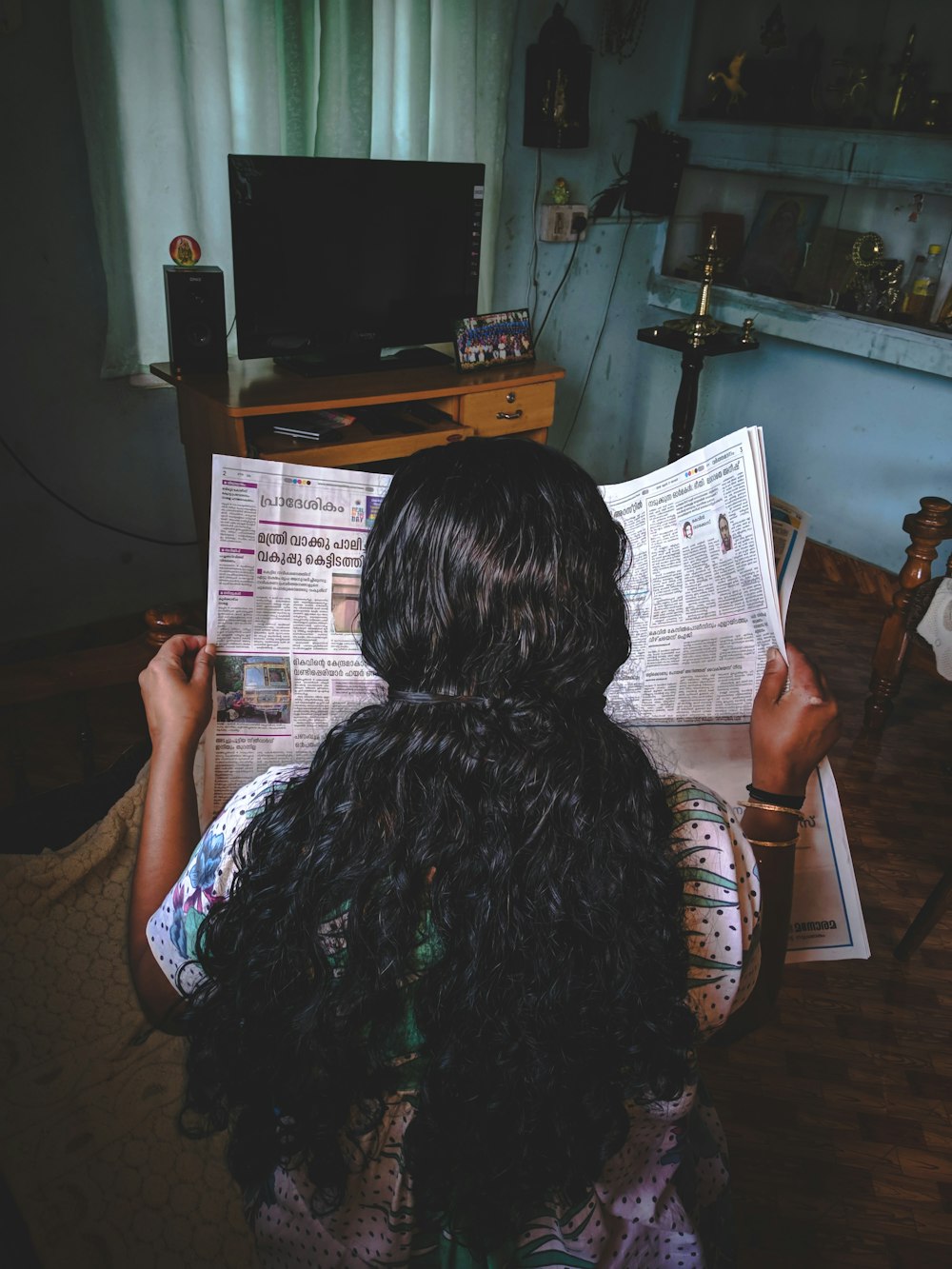 woman reading newspaper