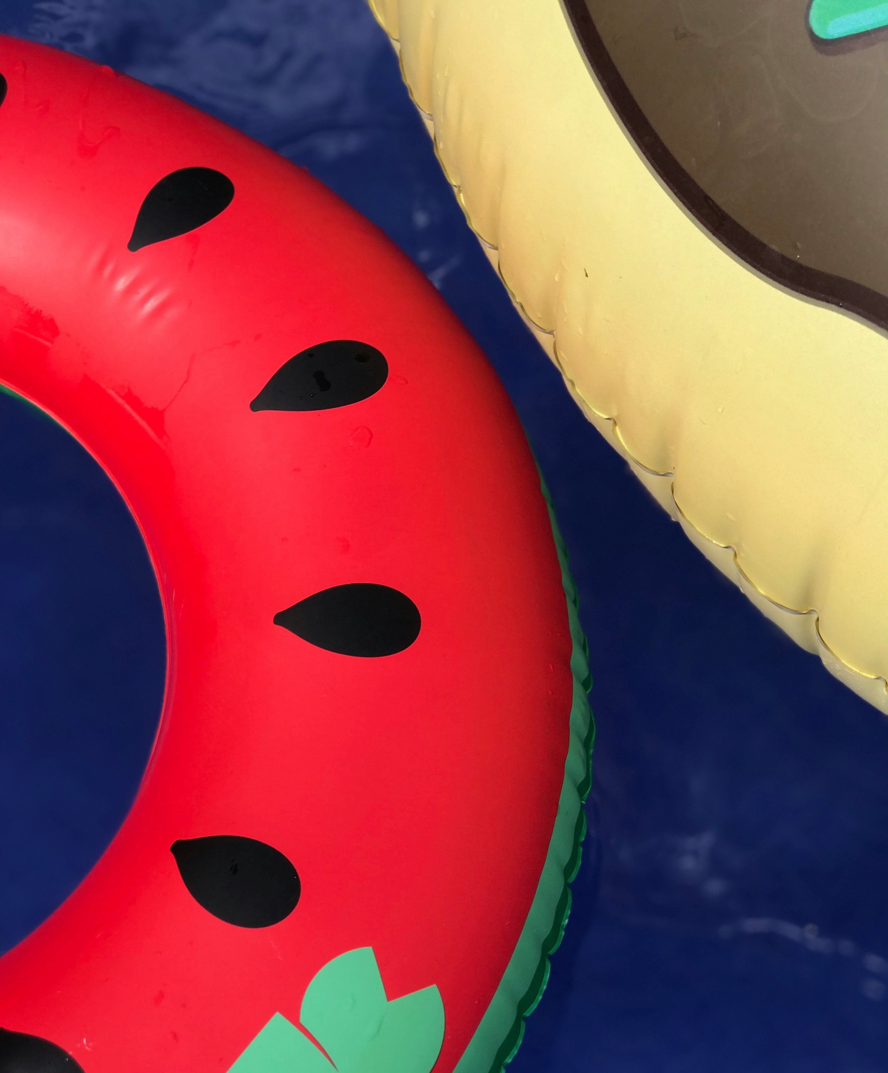two red and yellow inflatable floaters