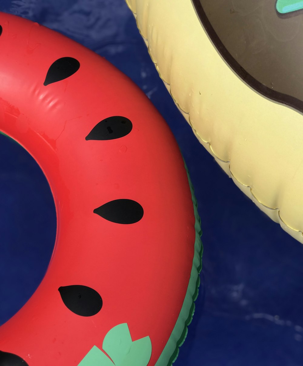 two red and yellow inflatable floaters