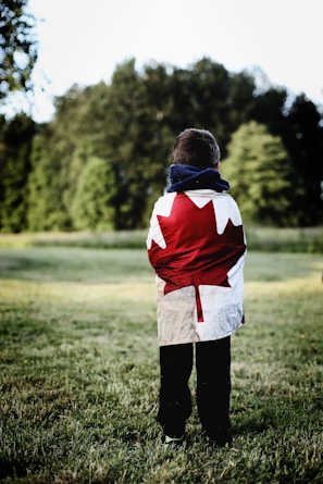 child wearing Canada flag