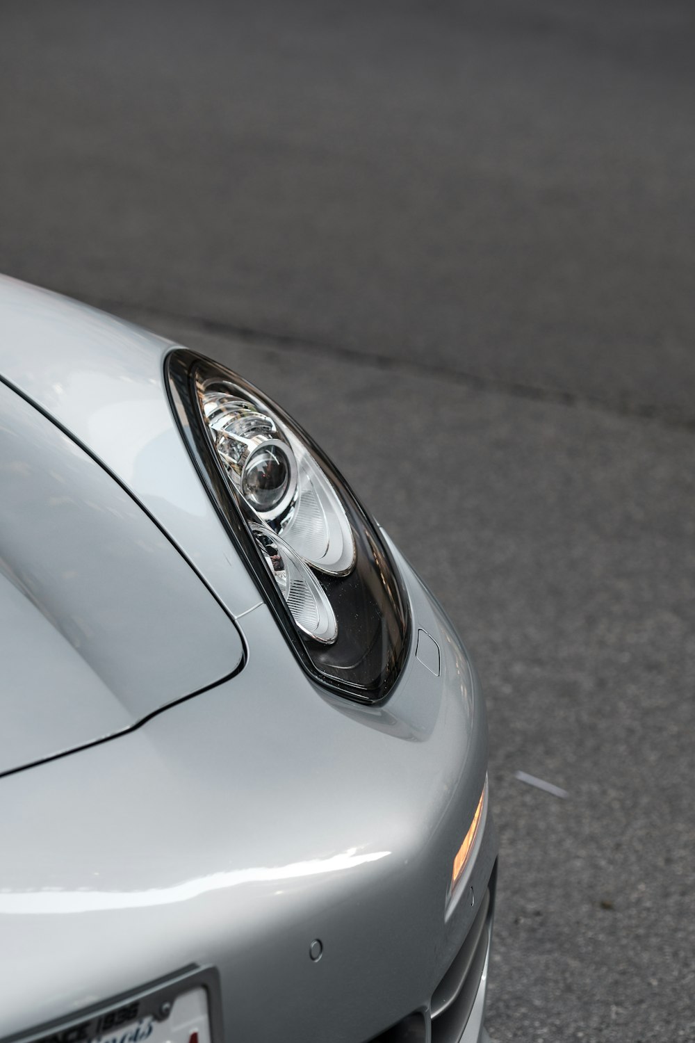 grayscale photo of car headlight