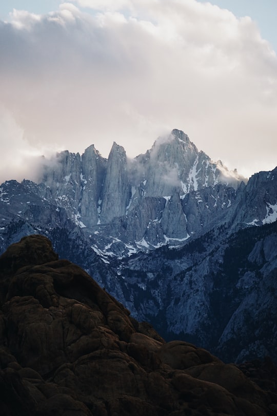 photo of gray mountains under cloudy sky in Alabama Hills United States