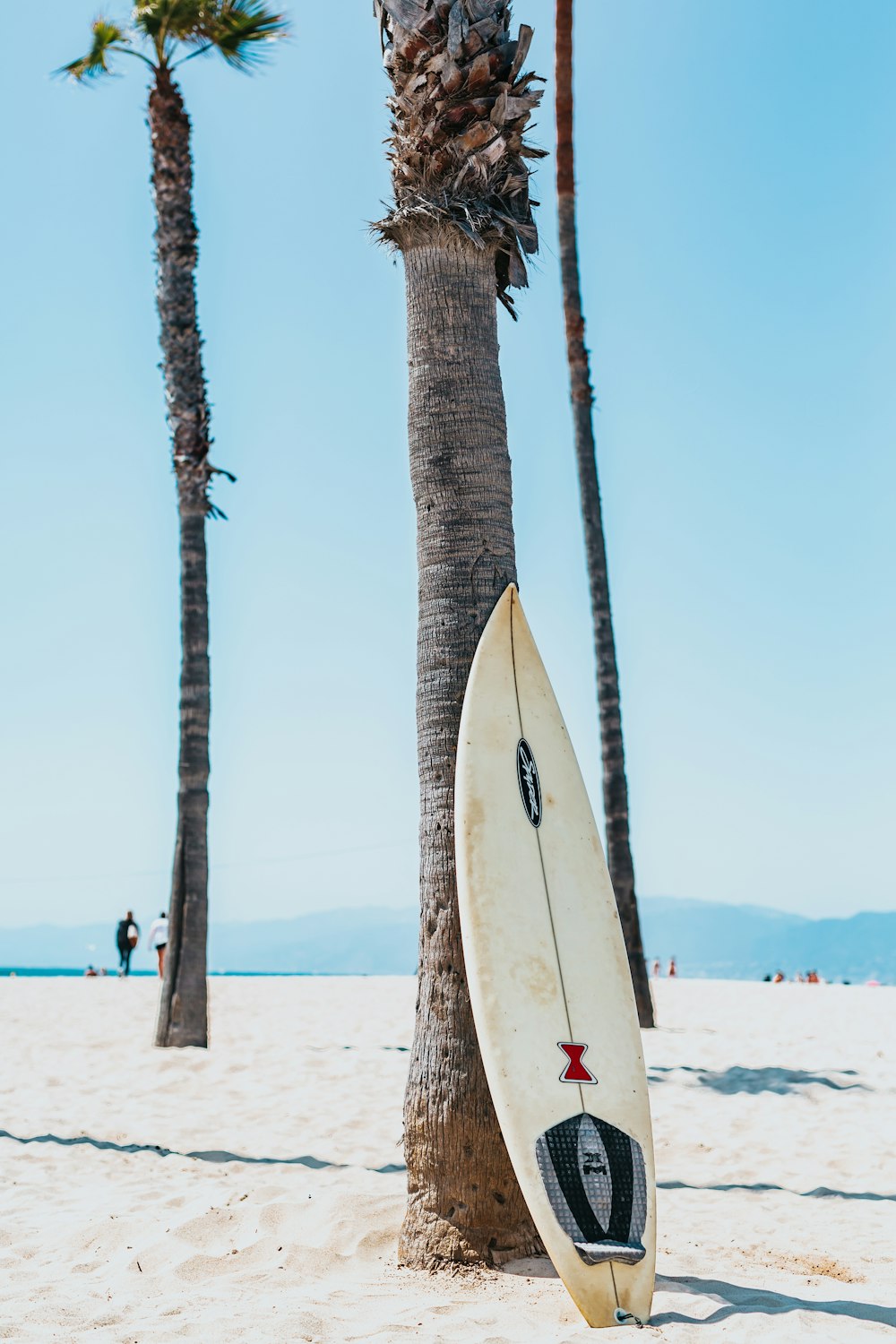 Surfer walking to beach