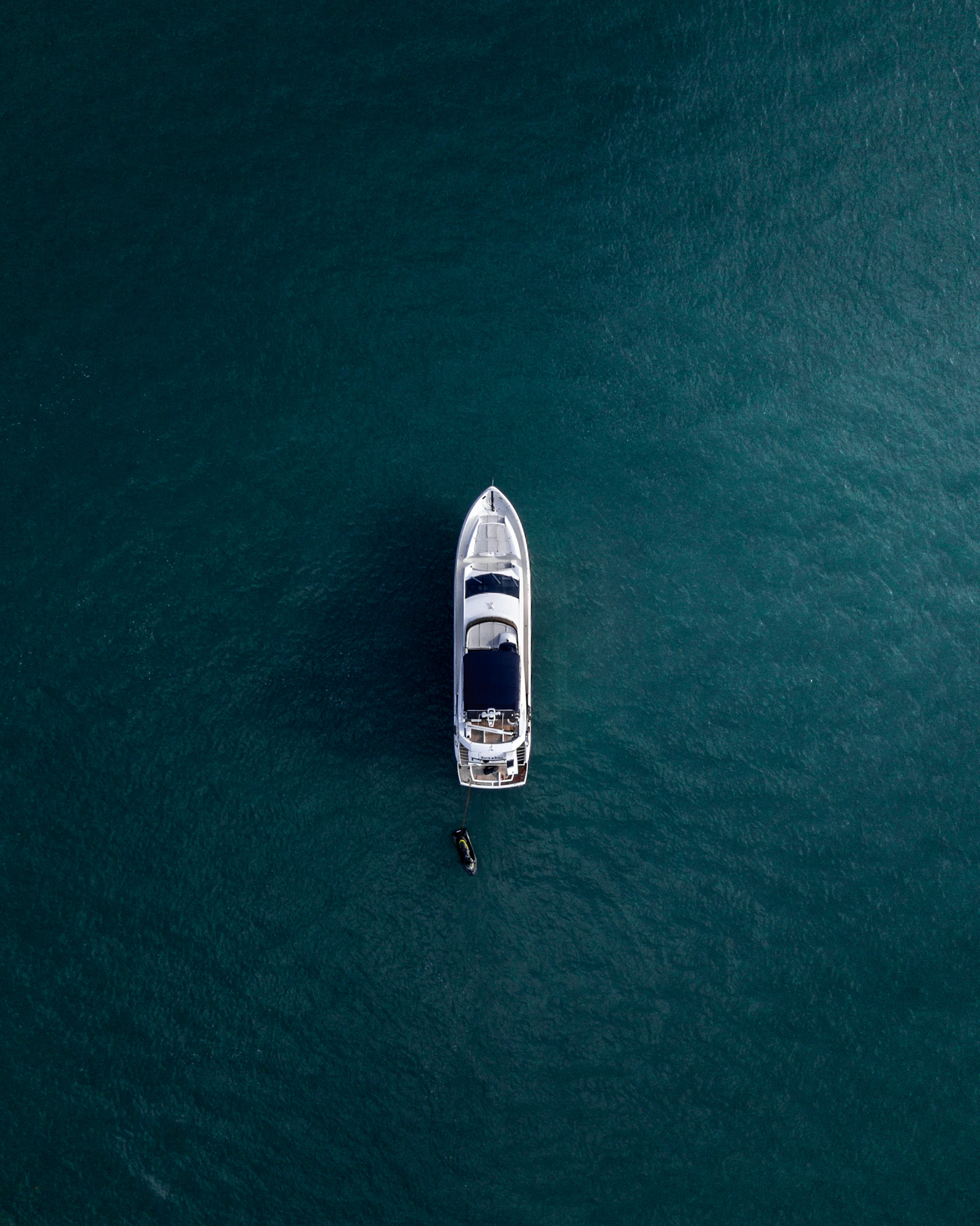 Velora 42 seen from above on calm green-blue water