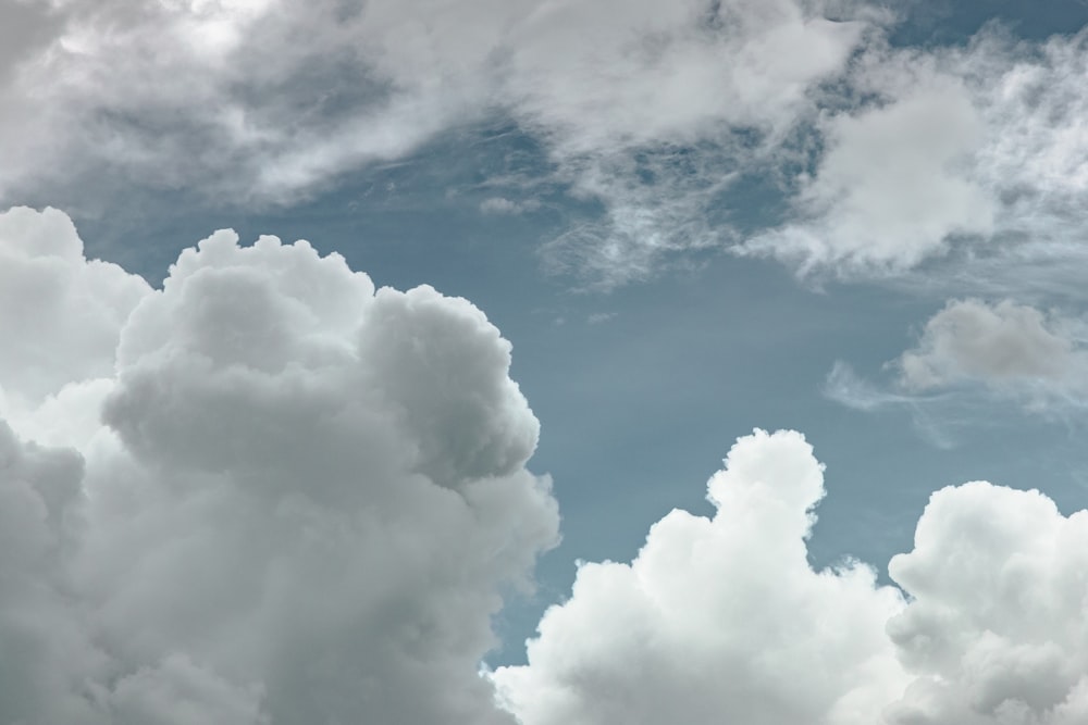 low-angle photo of white clouds at daytime