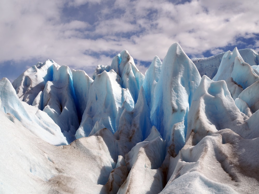 ice mountains under white clouds