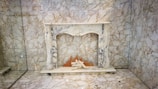 Restored fireplace area with fresh plaster and smooth edges after laser cutting