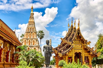 standing statue and temples landmark during daytime