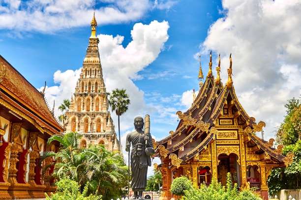 standing statue and temples landmark during daytime