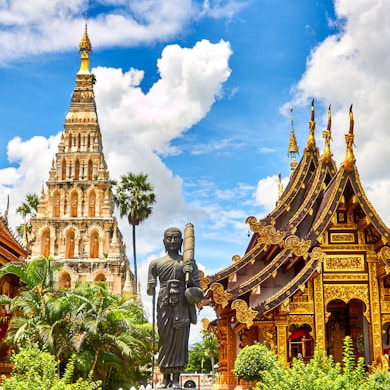 standing statue and temples landmark during daytime