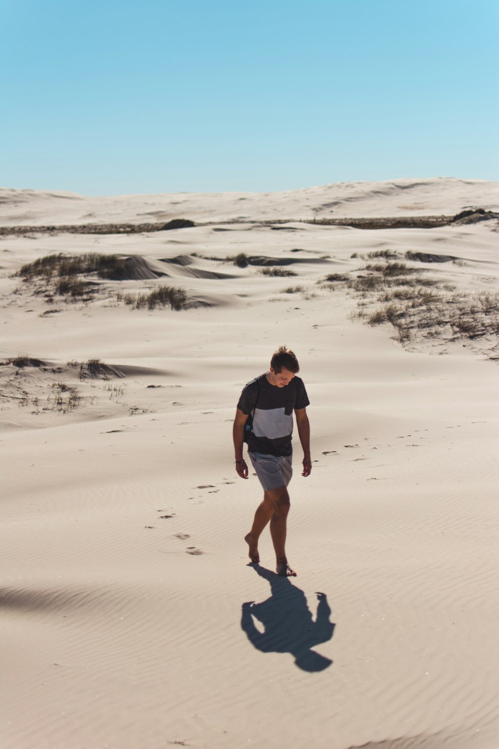 man walking on desert