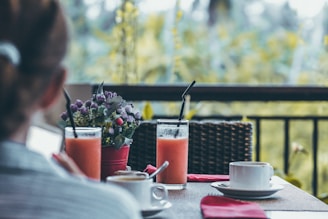 selective focus of drinking glasses filled with fruit juices