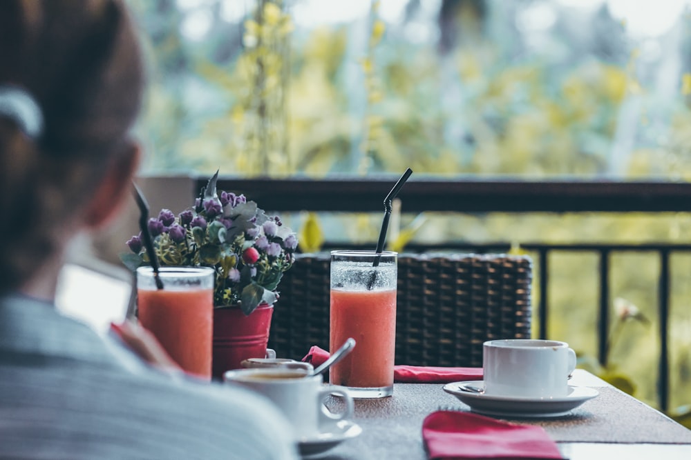 selective focus of drinking glasses filled with fruit juices