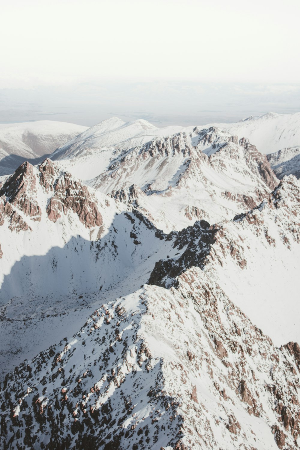 mountain alps under white sky