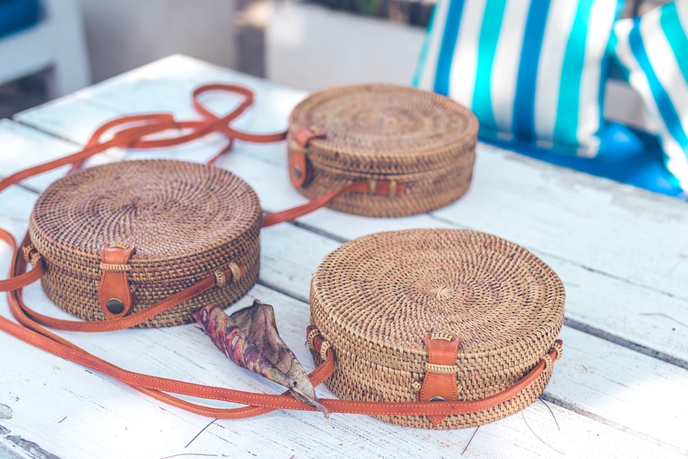 three brown wicker baskets