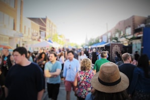 A bustling street market with diverse people and stalls.